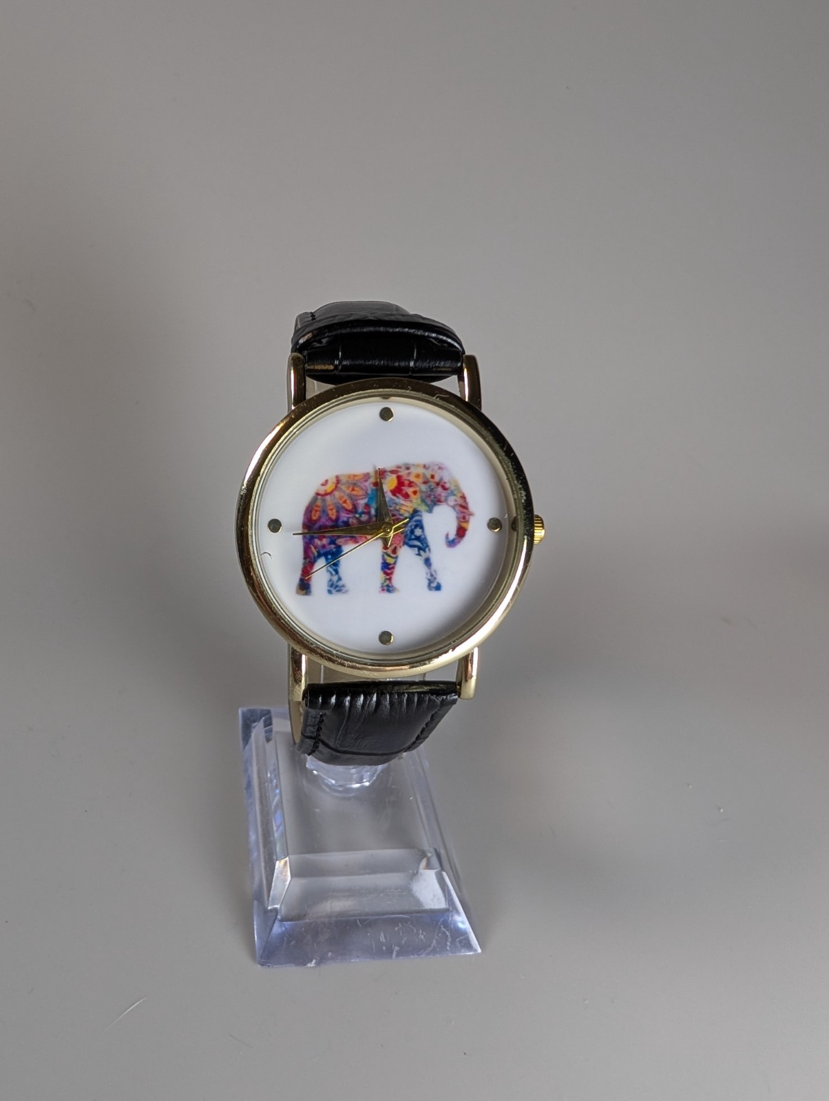 Elephant watch with flower pattern and dot indexes black leather band