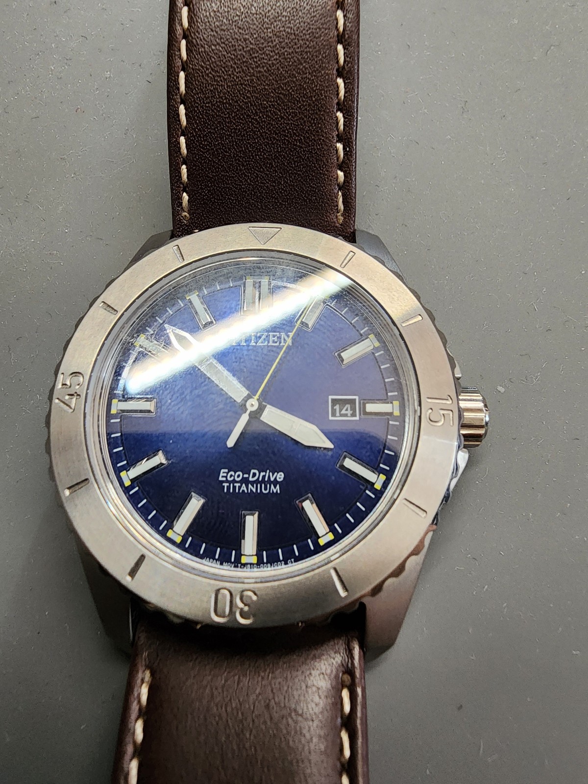 Citizen AW1840-09L Brycen Titanium Case Eco-Drive Leather Strap Blue Dial Watch