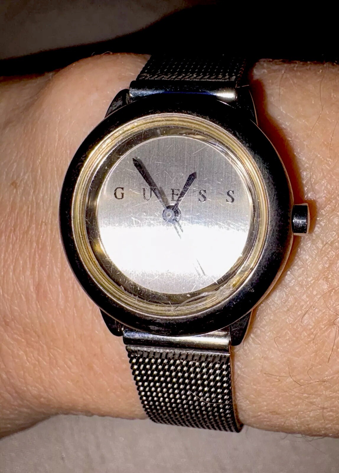 1996 GUESS numberless face watch. silver w adjustable mesh band. new battery.