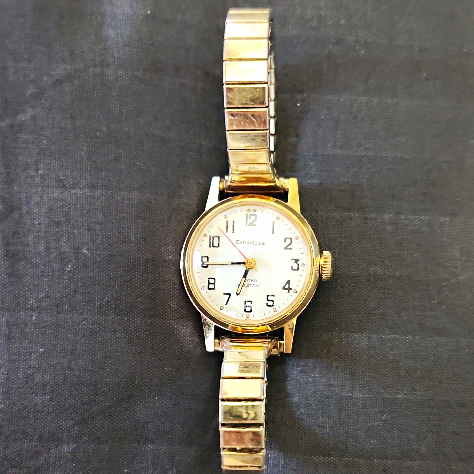Caravelle Mechanical Women’s Vintage Gold Tone White Arabic Stretch Bracelet