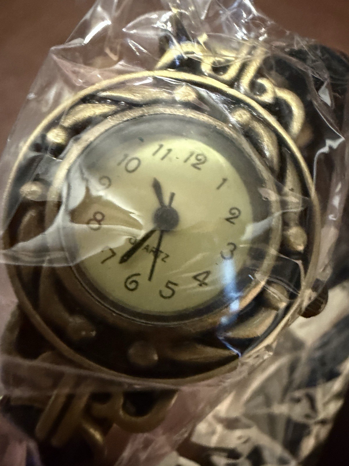 Women’s Quartz Wristwatch Black Leather Wrap-Around Strap Bronze Brushed Case