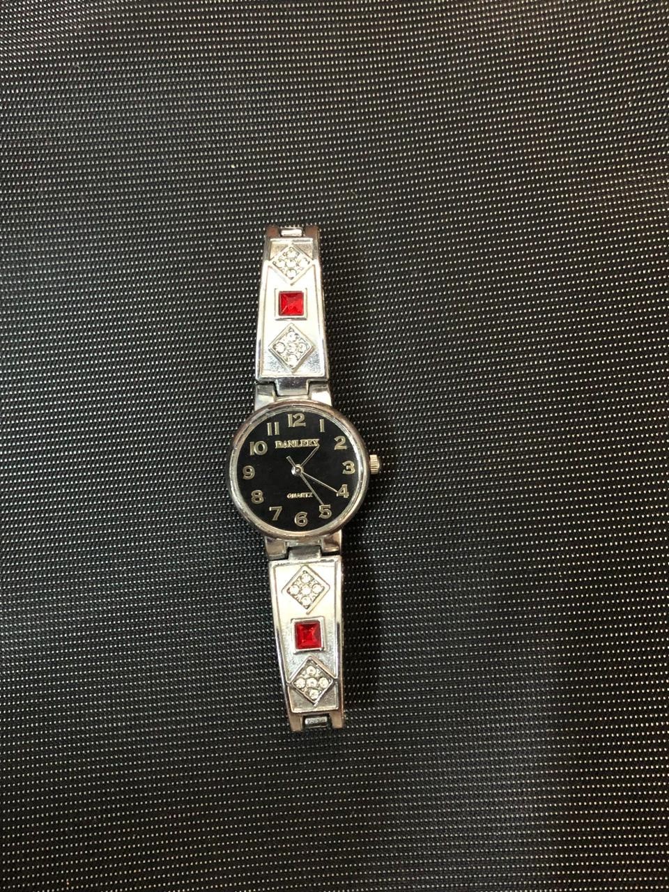 Vintage DANLEEX Womens Quartz Bangle Watch Silver Tone Red Rhinestone Black Dial